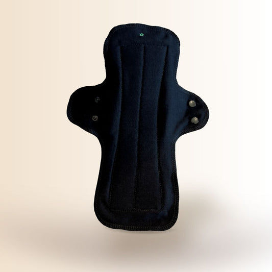 Black reusable night pad with wings and secure snaps for overnight menstrual protection