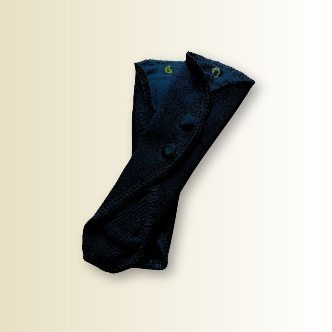 Flat lay of 2-pack black thong pads in cotton for light absorbency