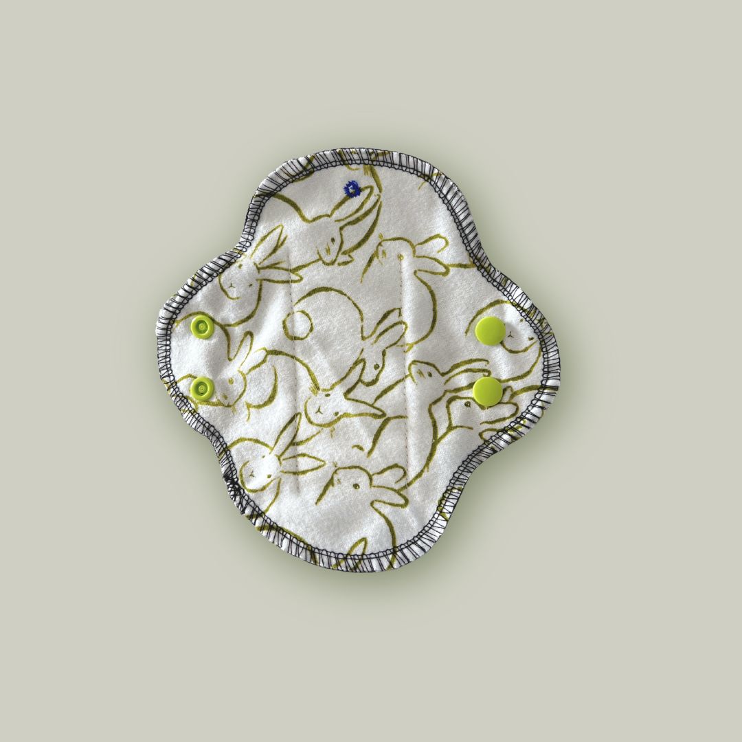 Top view of Hume’s teen reusable menstrual pad showing bunny print fabric side — breathable, fun, and ideal for younger users.