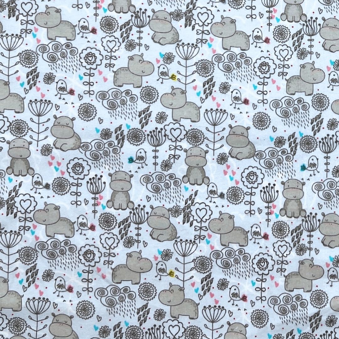 Close-up of hippo and botanical print used in Hume’s thong pads. Cute and whimsical fabric design in gray tones.