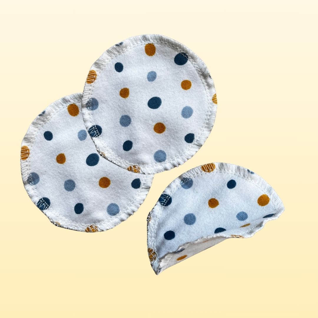 Close-up of soft cotton flannel rounds – reusable face pads in pastel colors