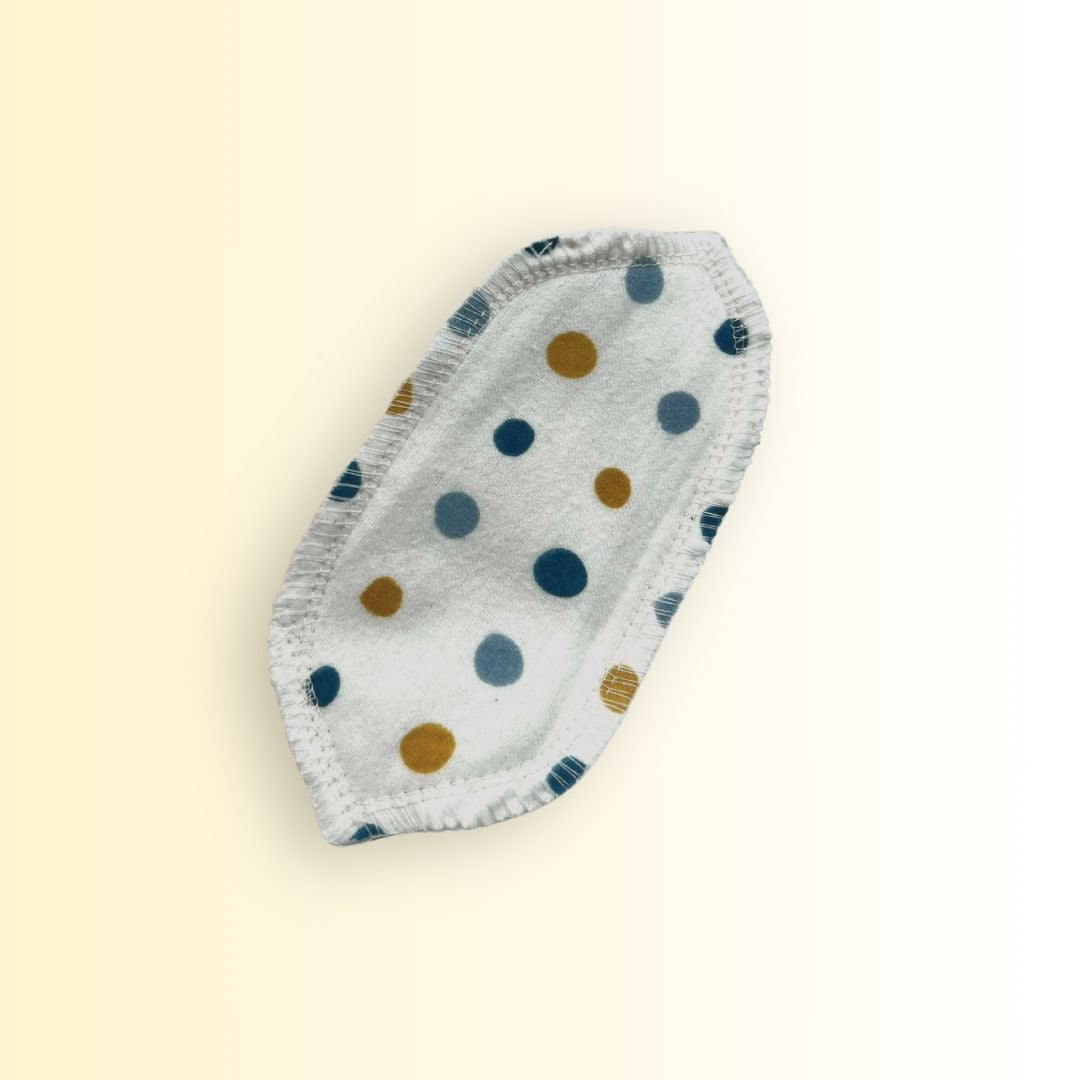 Single reusable interlabial pad by Hume’s made from cotton flannel with blue and yellow polka dots