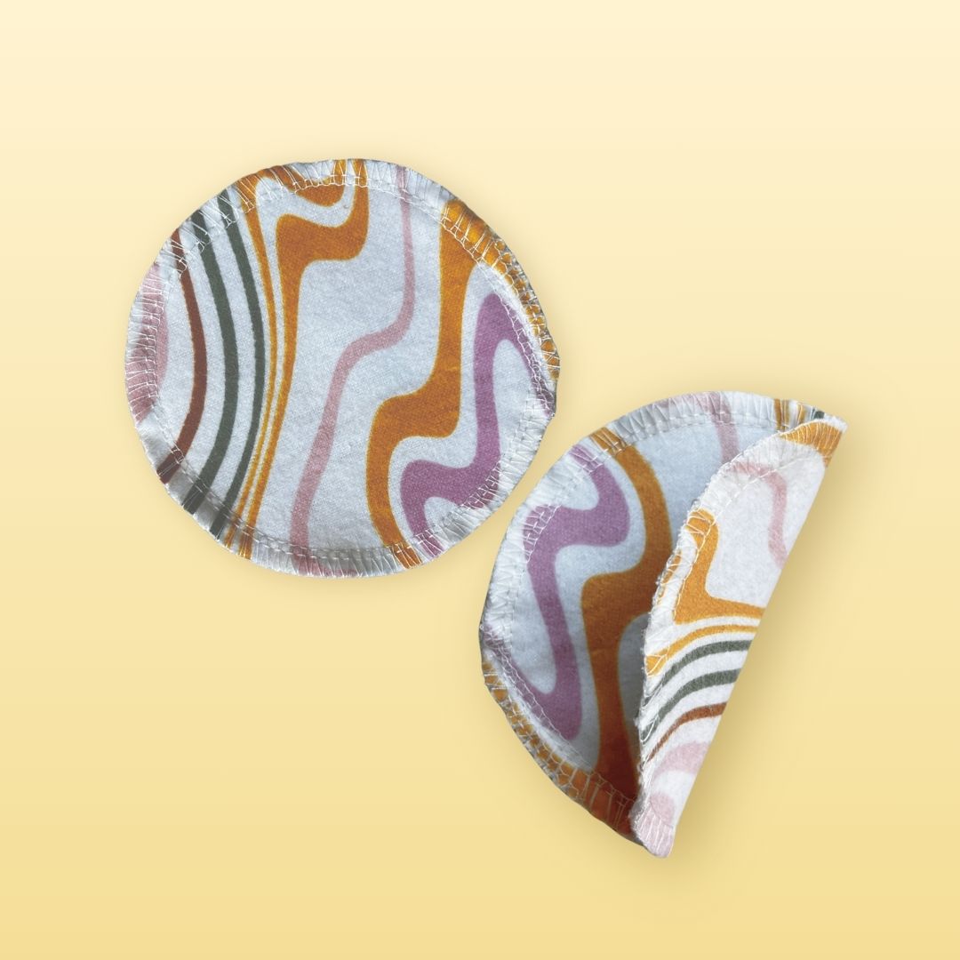 Two reusable round cotton flannel face pads, one shown folded to display layers and softness