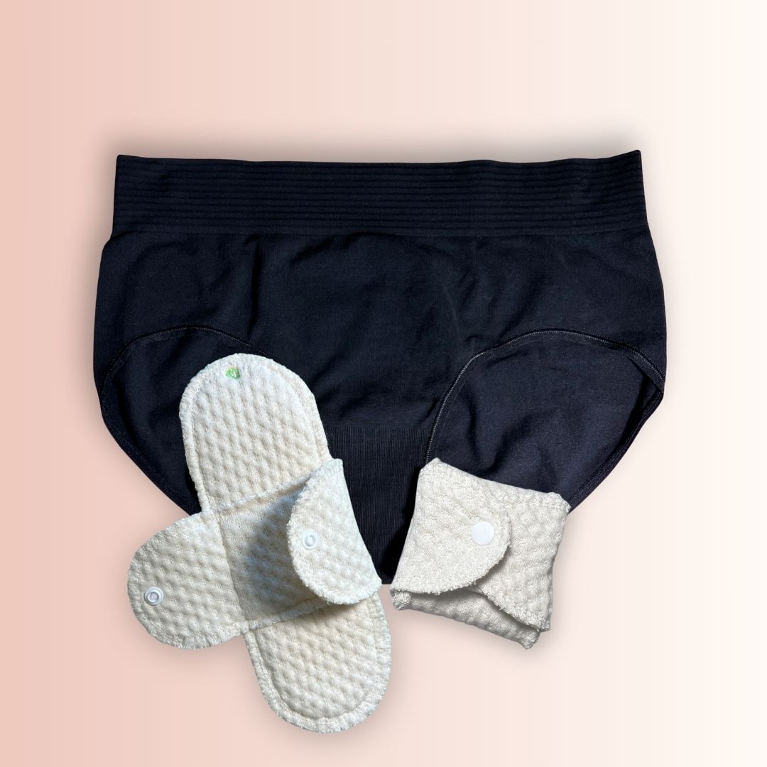 Back and folded of Hume’s organic cotton pad with no plastic or impermeable layer next to an underwear