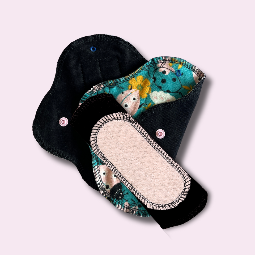 Back side of reusable pad showing organic cotton absorbent core – breathable and soft for teen