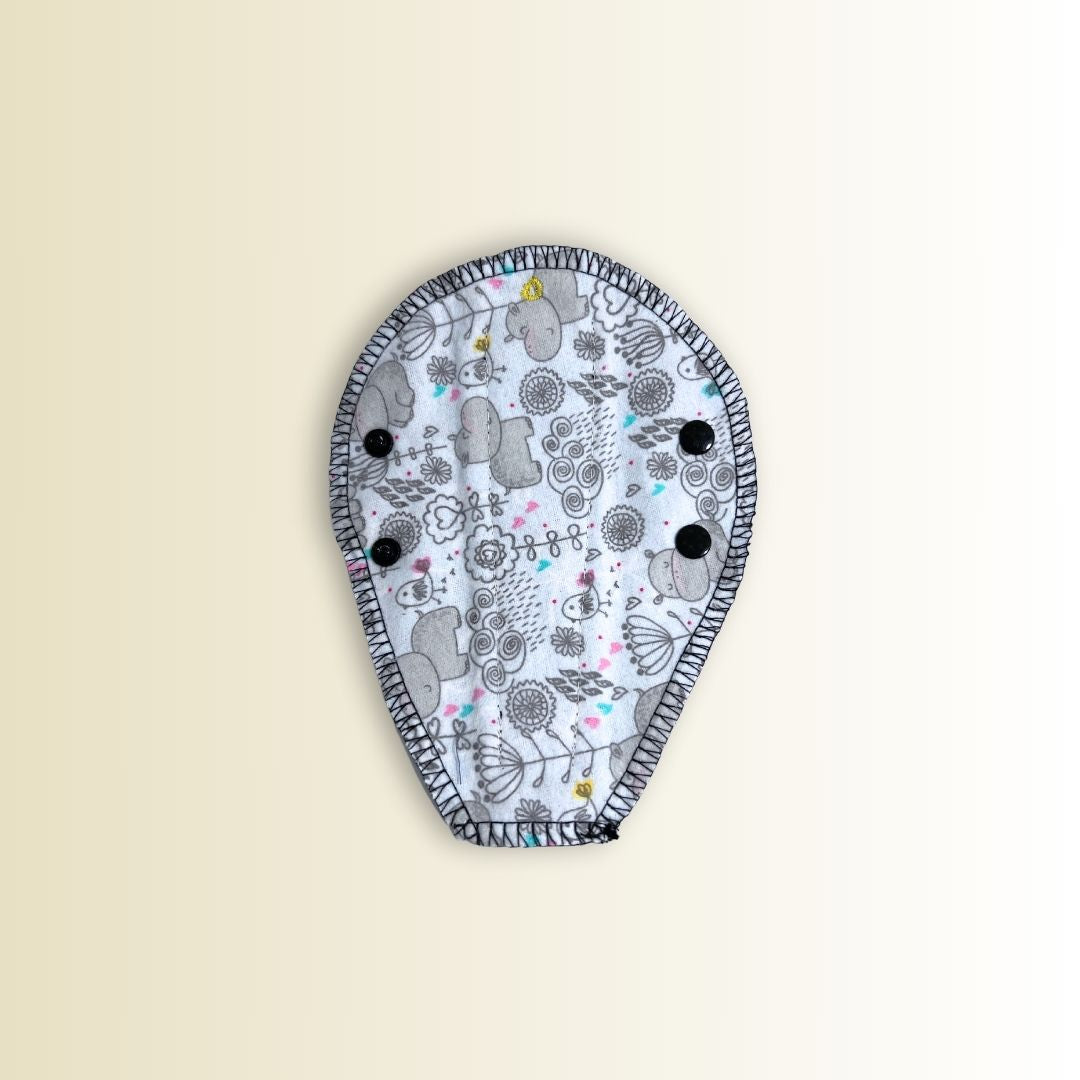 Reusable thong panty liner in gray hippo and floral print. Breathable cotton top layer with secure black snap wings.