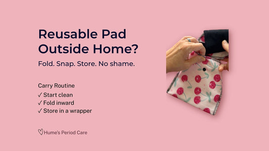Reusable pad being placed into a cherry print wrapper for carrying reusable period care outside home.
