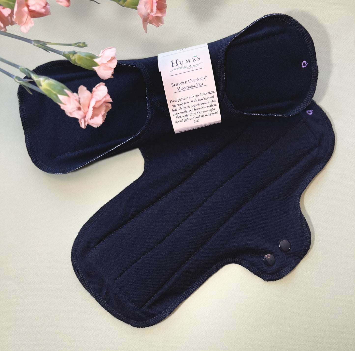 Set of two black reusable cloth night pads with soft fabric and winged design