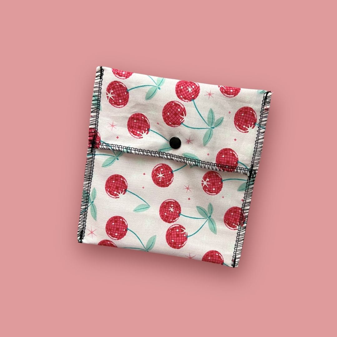 Matching cherry print carry pouch for reusable cloth pad