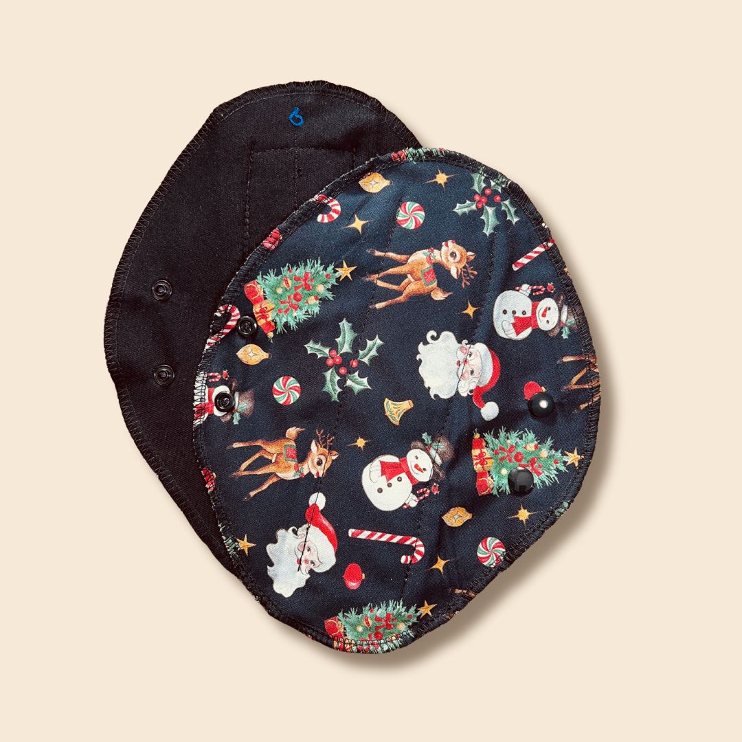 Black reusable menstrual pad with Christmas print — organic cotton core, holiday editio