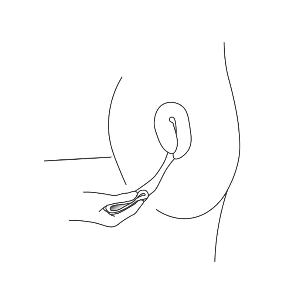 Line drawing of a person inserting a pinched menstrual disc into the vaginal canal, angled toward the cervix