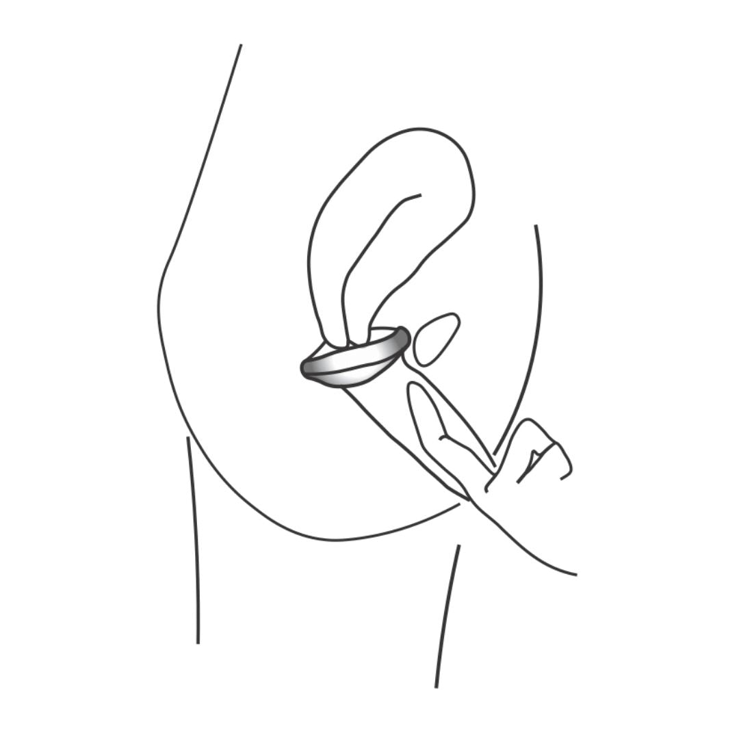 Illustration of a finger tucking the front of a menstrual disc behind the pubic bone for proper placement