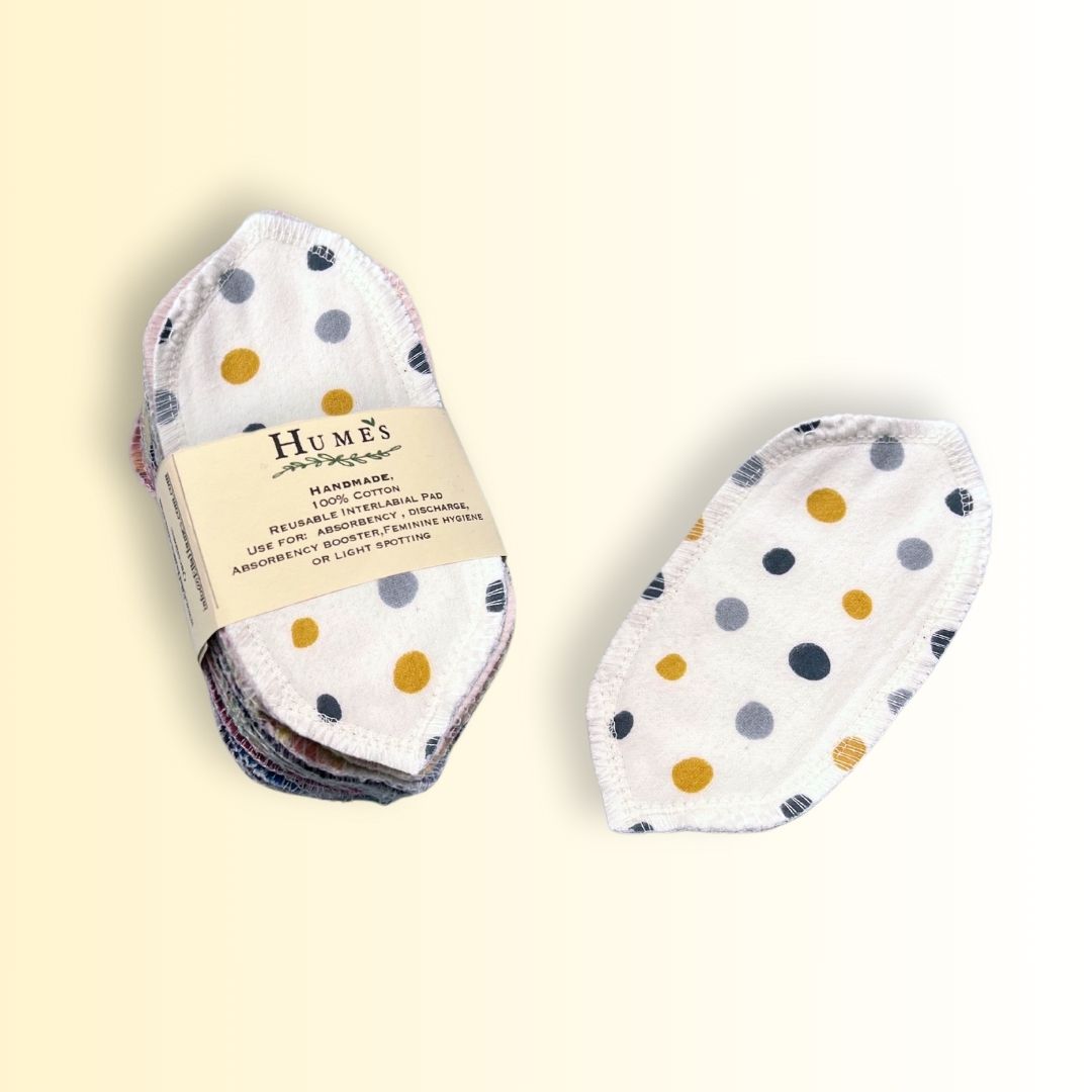 15-pack of reusable interlabial pads by Hume’s, made from soft cotton flannel with colorful polka dots