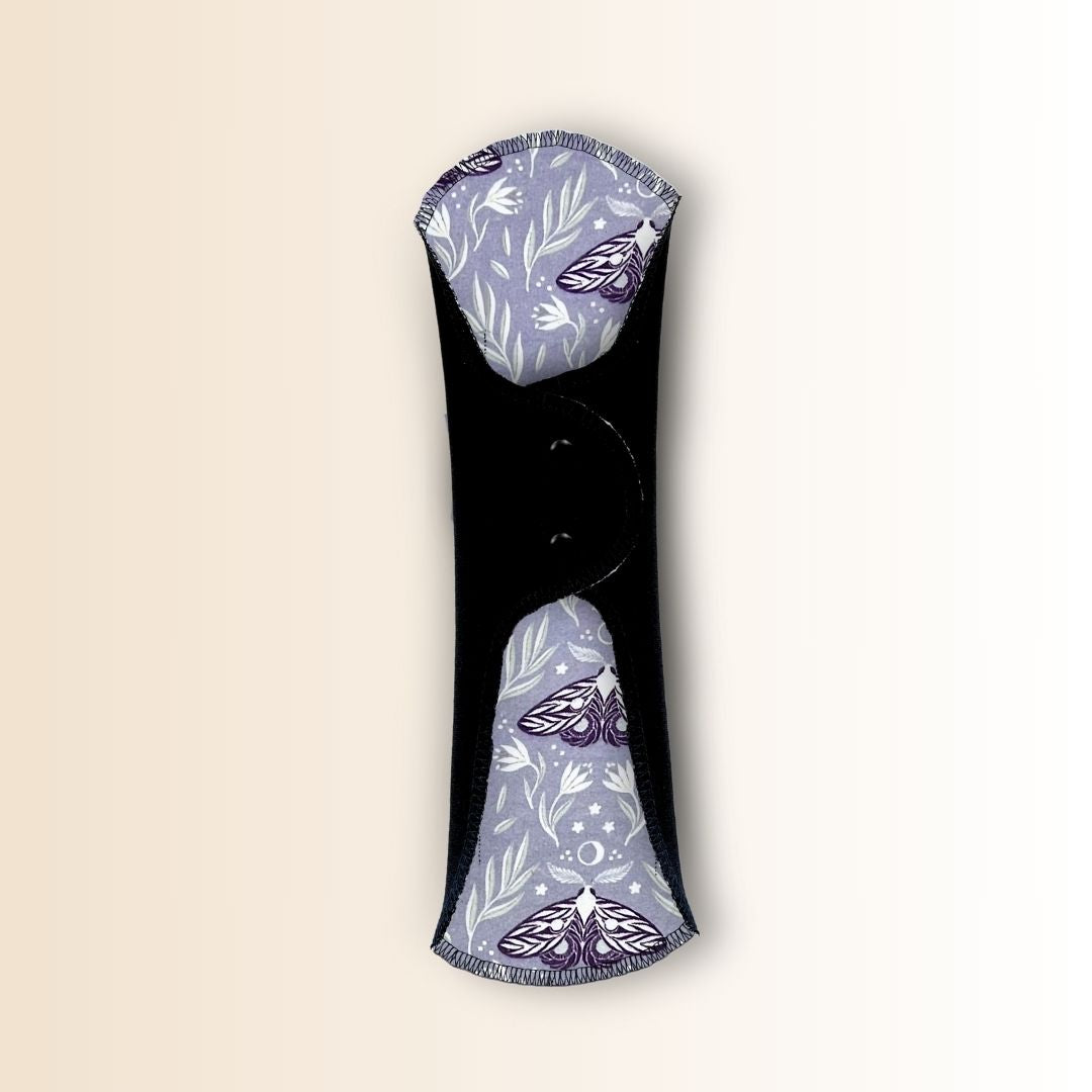 Hume’s moth night pad shown folded with snap wings for a secure and adjustable fit.