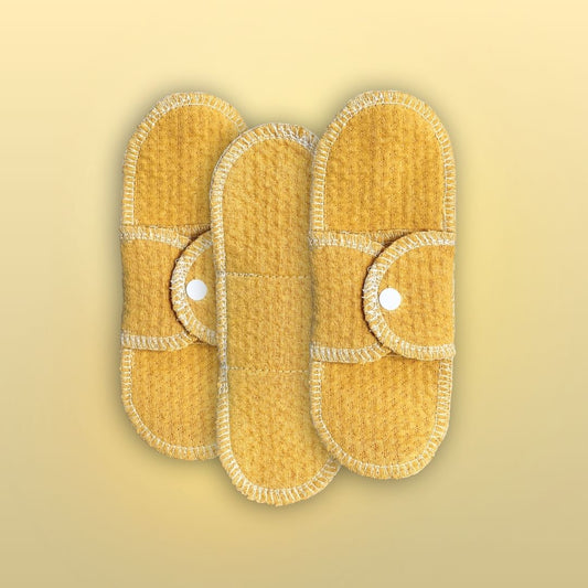 Organic cotton reusable pad in golden sand color – light flow