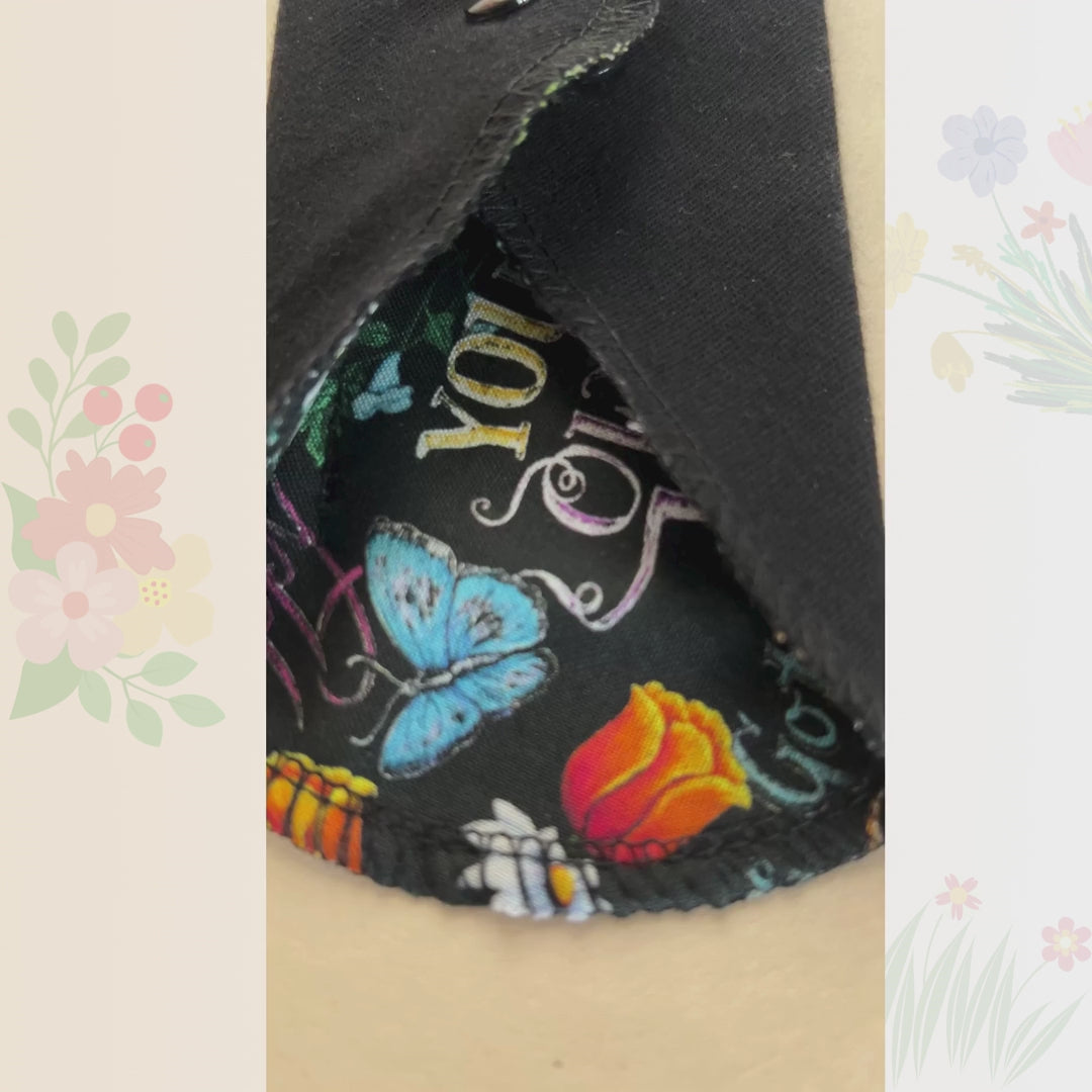 Video showing sunflower floral reusable cloth pads with snap wings and black cotton lining from Hume’s Period Care.
