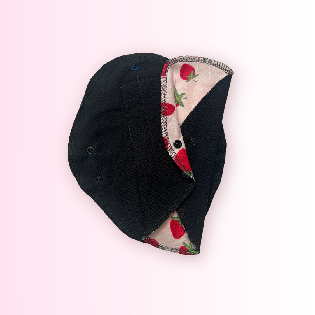 Front view of a strawberry washable period pad by Hume’s Period Care.