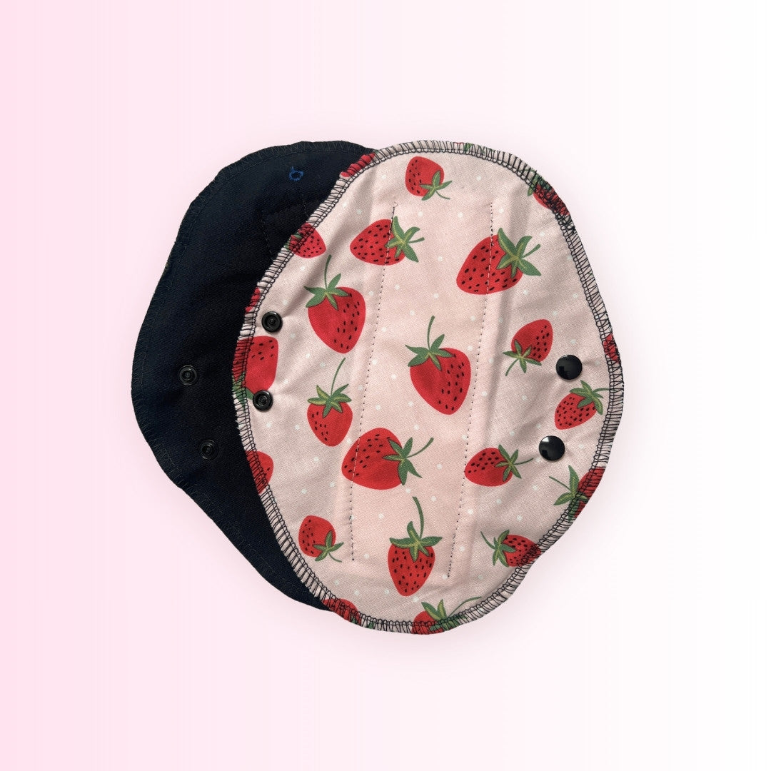 Front view of a strawberry washable period pad by Hume’s Period Care.