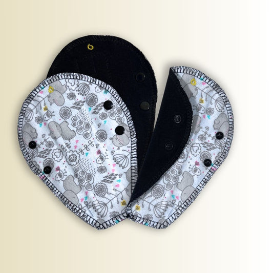 Set of 3 reusable thong panty liners with adorable hippo print. Soft, breathable, and shaped for thong underwear.